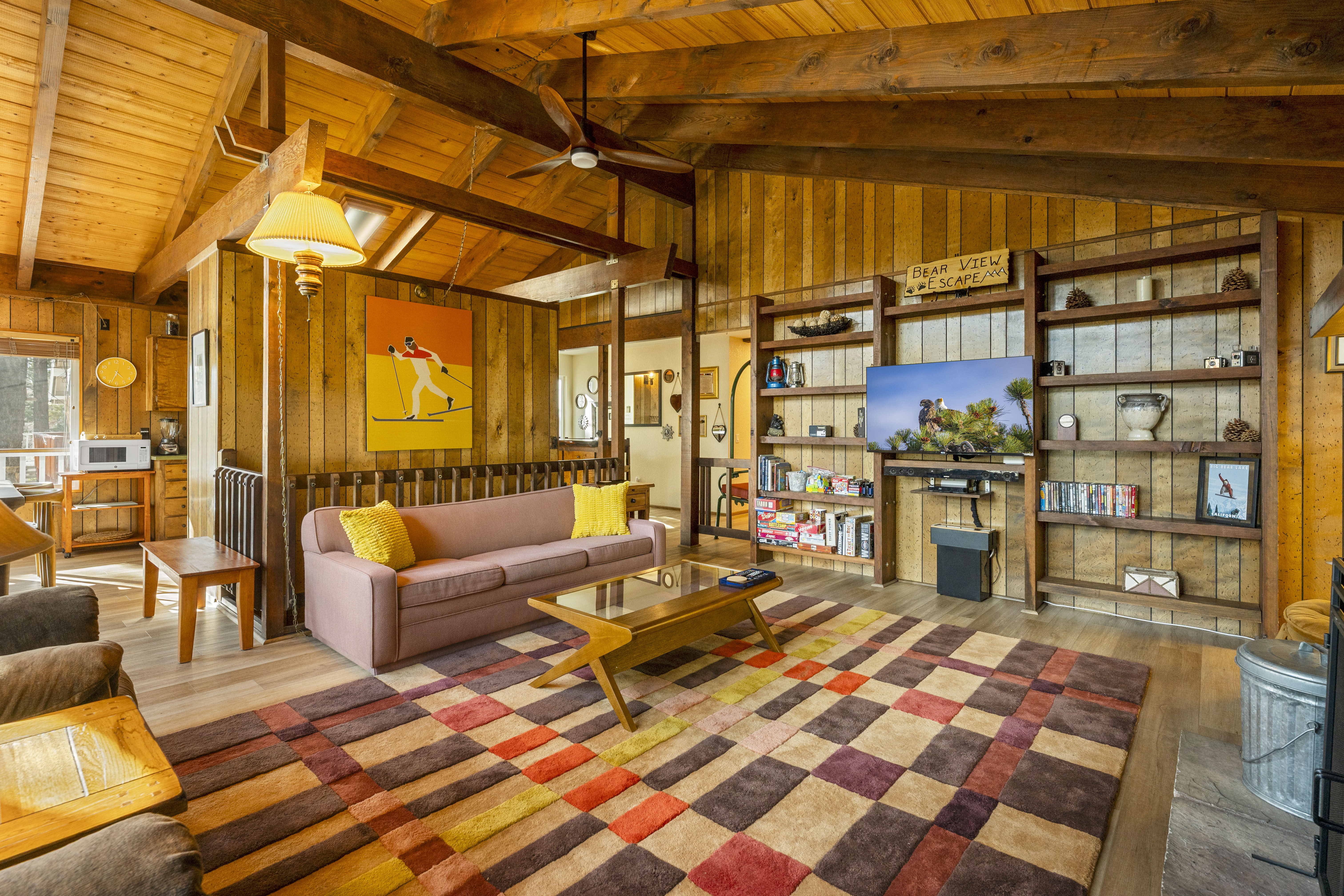 Living room with stone fireplace at Bear View Escape in Big Bear Lake